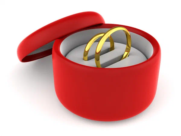 1092058-stock-photo-wedding-rings-in-red-round